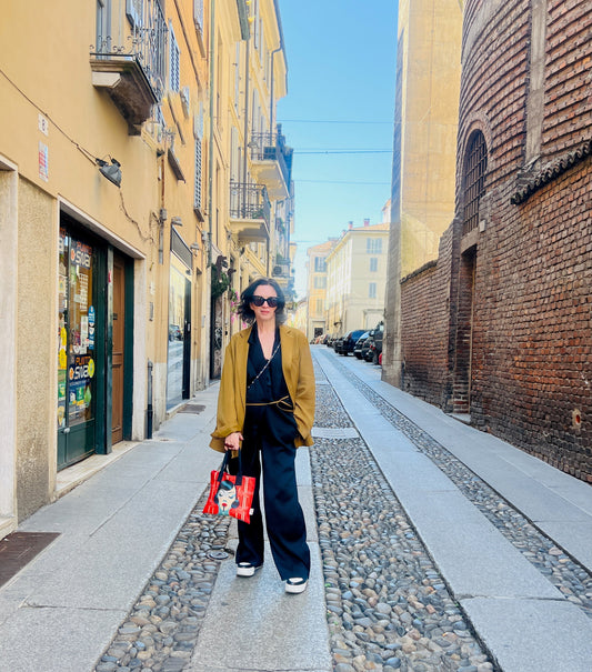 On the streets of Milan with the Shanghai Girl mini tote — where East-meets-West style walks with confidence. Designed by Corrie MacDonald, founder of Jinty Designs.